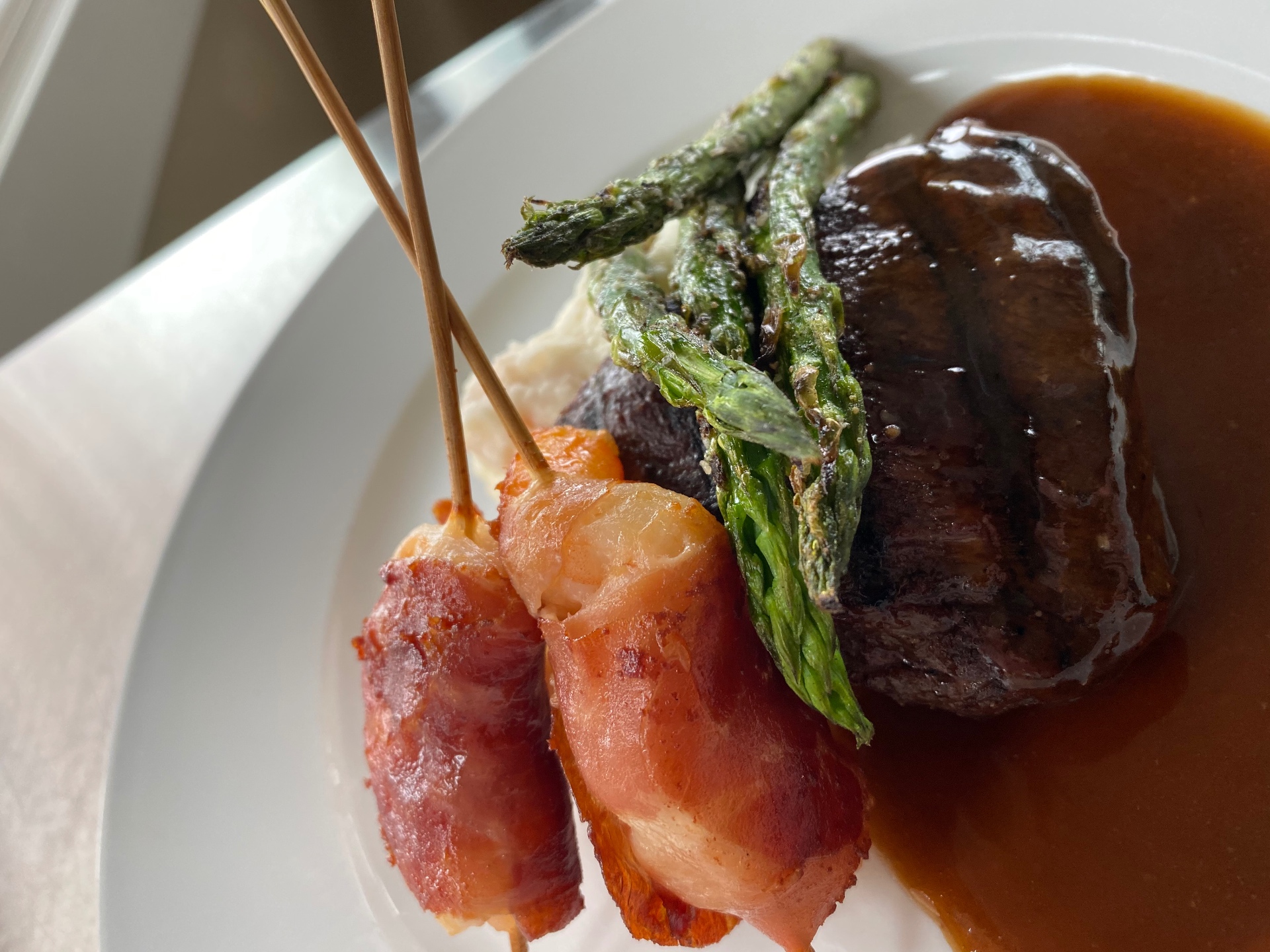 Filet with red wine demi, grilled asparagus, and bacon-wrapped scallops